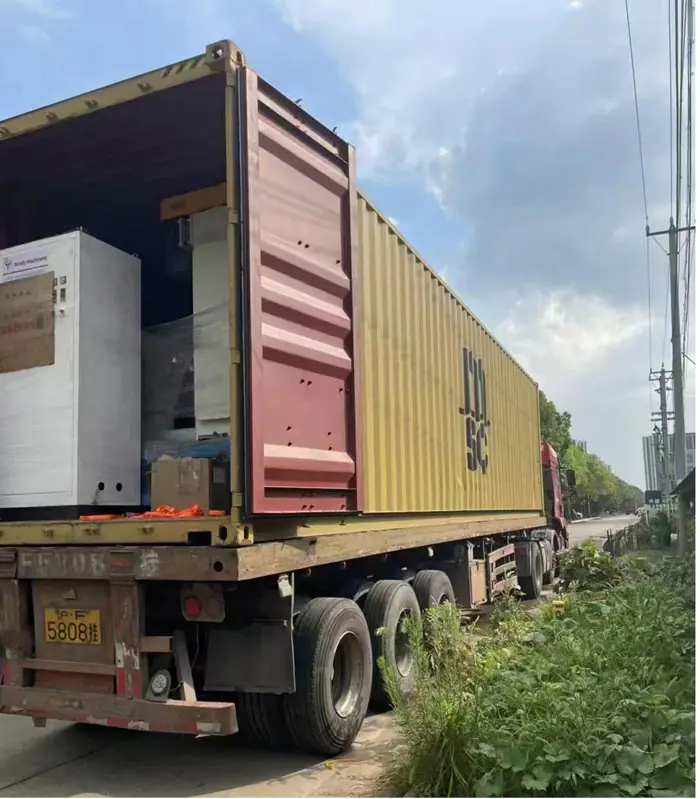 Open shipping container on a truck outside the factory